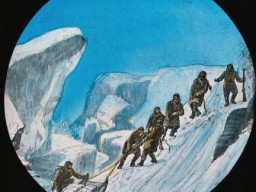 A historic illustration showing a group of men hauling a heavily laden sledge up a steep snowy incline. 